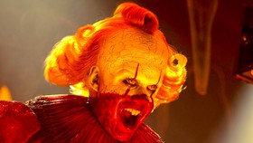 Pennywise with blood on his face in It: Welcome to Derry.