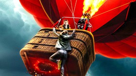 Turbulence movie poster with someone hanging off the side of a hot air balloon.