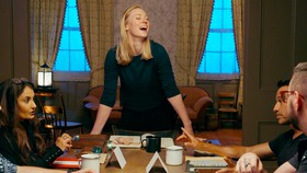 Deborah Ann Woll standing up from the table during Tales From Woodcreek.