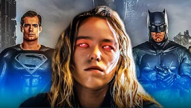 The DCU's Supergirl standing between the DCEU's Superman and Batman.