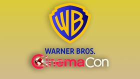 Warner Bros. logo and CinemaCon logo against yellow background.