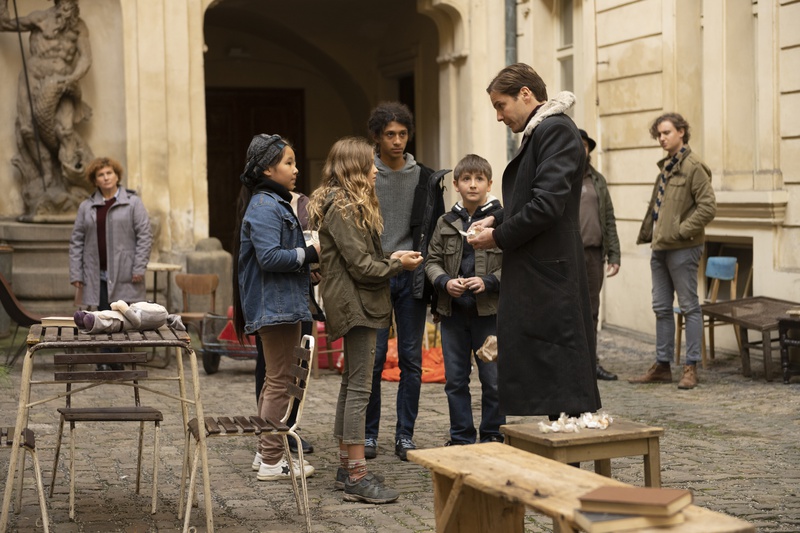 Baron Zemo hands candy to children